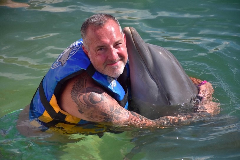 Carl Allen Hugging Happy Dolphin